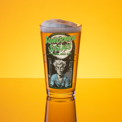 Pint glass with 'Sundown Sillies' label on a yellow background